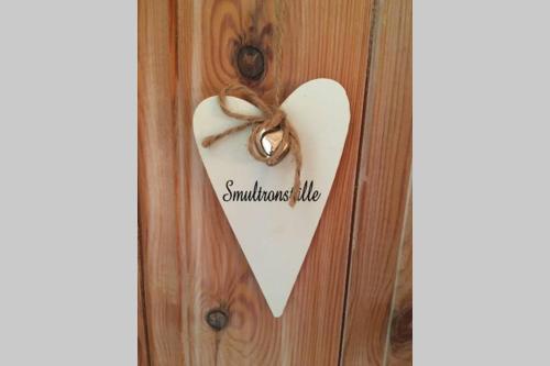 a heart hanging on a door with a bow at Dalastugan in Mora