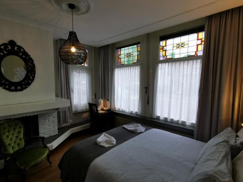 Postel nebo postele na pokoji v ubytování Hotel Heere