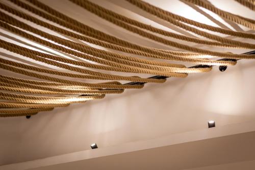 a ceiling made out of wooden sticks at Eleals Boutique Hotel in Perama