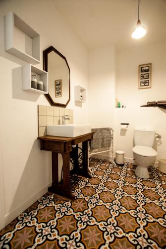 a bathroom with a sink and a toilet at La Calade in Montouliers