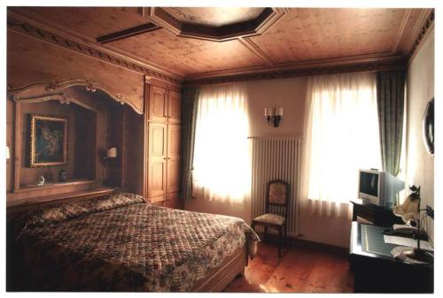 Postel nebo postele na pokoji v ubytování Cadore Haus