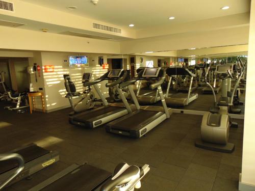 a gym with several treadmills and cardio machines at Radisson Blu Ankara in Ankara