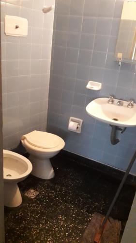 a bathroom with a toilet and a sink at HOTEL SAN JORGE in San Clemente