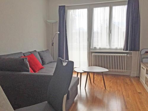 a living room with a couch and a table at Ferienwohnung in Bern in Bern