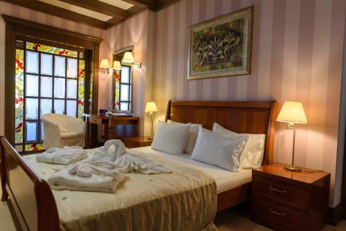 Кровать или кровати в номере Шале Грааль Апарт-Отель