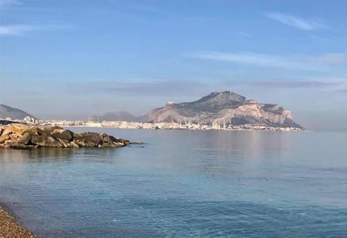 a view of the ocean with mountains in the background at Ciccio Rooms and breakfast - Self check-in in Palermo