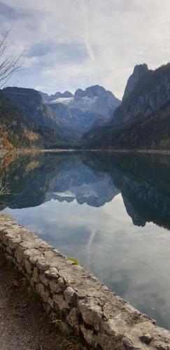 a large body of water with mountains in the background at Pension Edelweiss, apartment Amsterdam 4-6 pers in Gosau