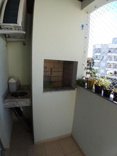 Una cocina o zona de cocina en Apto Aconchegante - 4 pessoas - próximo centro de Florianópolis