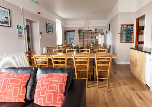 a dining room with a table and chairs at Gairloch Sands Youth Hostel in Gairloch