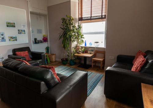 a living room filled with furniture and a window at Gairloch Sands Youth Hostel in Gairloch