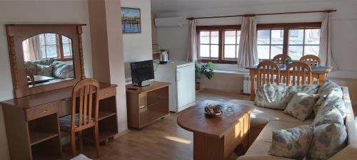 a living room with a couch and a table at Citadel Guest House in Varna City