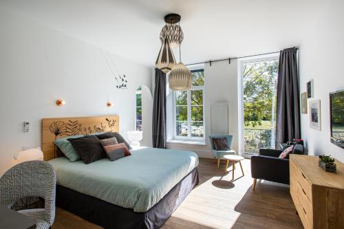 Postel nebo postele na pokoji v ubytování Le 49 Côté Parc & SPA