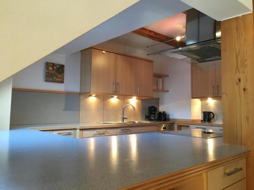 a kitchen with a sink and a counter top at Loft Krämerhaus Annaberg, Dachstein West in Annaberg im Lammertal