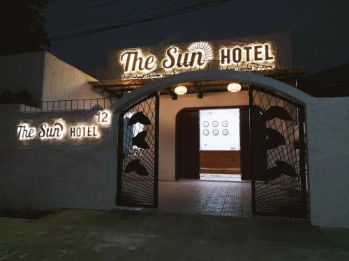 a building with a sign that reads the sun hotel at The Sun Hotel in Tây Ninh