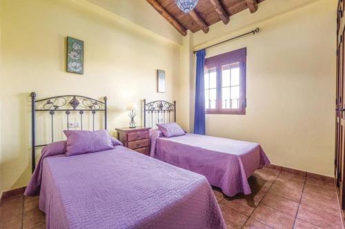 Un pat sau paturi într-o cameră la El Manantial