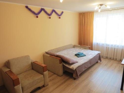Postel nebo postele na pokoji v ubytování Apartment on Masaryk st.
