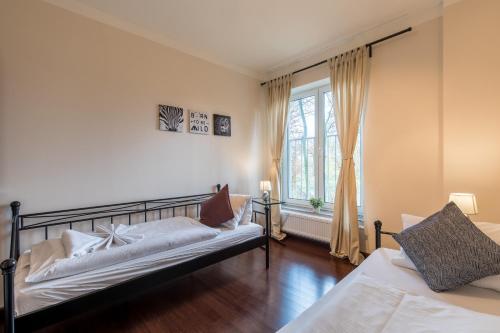 Ένα ή περισσότερα κρεβάτια σε δωμάτιο στο Rezidence Moser Apartments