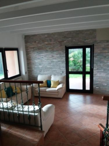 a living room with a couch and a table at villa Fiametta in Pula