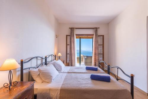 Ένα ή περισσότερα κρεβάτια σε δωμάτιο στο Villa Andonis Nissaki