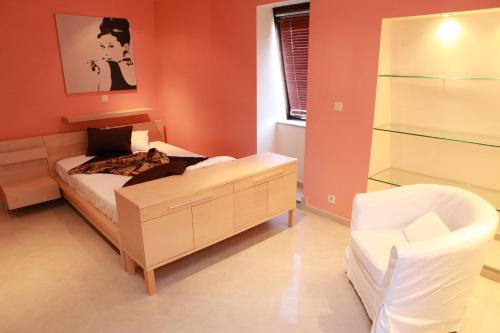 Ένα ή περισσότερα κρεβάτια σε δωμάτιο στο Residence la Fraisiere
