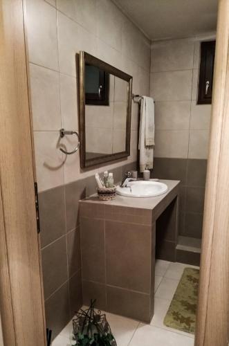 a bathroom with a sink and a mirror at Villa Elia in Sfakia