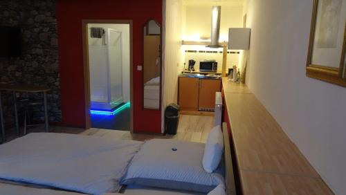 Säng eller sängar i ett rum på Pension & Gästehaus Paffrath