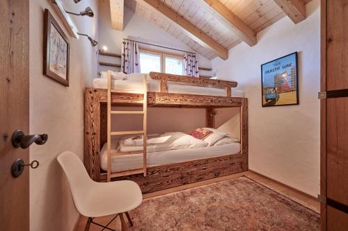 Ένα ή περισσότερα κρεβάτια σε δωμάτιο στο Chalet Bärgsunna Penthouse
