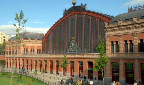 a large building with people walking in front of it at Fridda House Atocha Madrid in Madrid