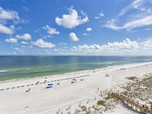an overhead view of a beach with people and the ocean at Summerchase 1 in Orange Beach