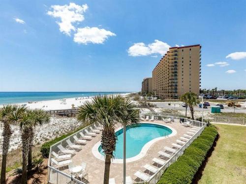 a view of a resort with a swimming pool and a beach at Seaside Beach and Racquet Club Condos II in Orange Beach
