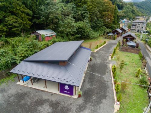 an overhead view of a house with a solar roof at SHIOYA SPA in Minakami