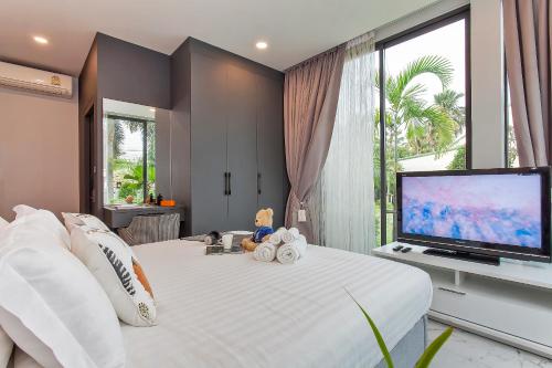 Katil atau katil-katil dalam bilik di Stylish 2-Villa Combination by Hi At Home