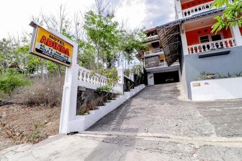 a sign in front of a building at Adinda Beach Hotel and Villa in Bantul