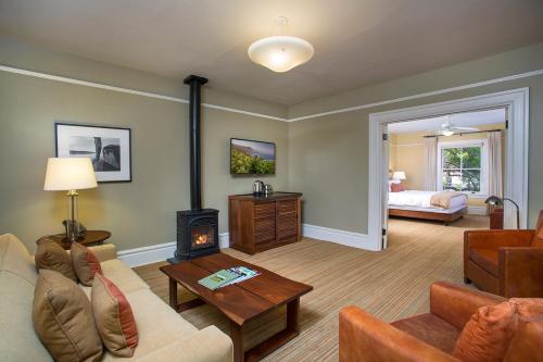a living room with a couch and a fireplace at Cavallo Point in Sausalito
