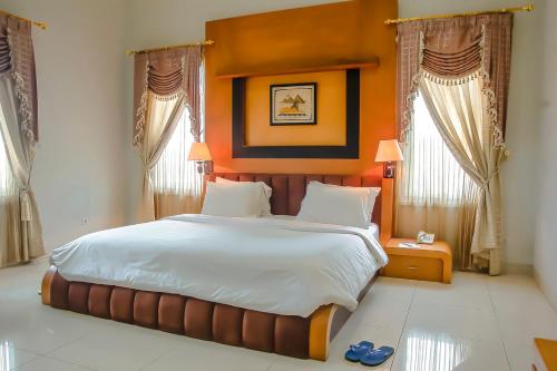 Un pat sau paturi într-o cameră la Novilla Boutique Resort