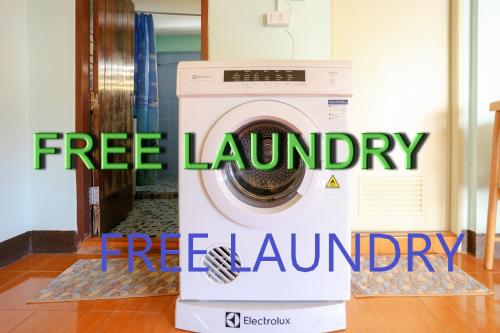 a washing machine with the words free laundry a free laundry at Home of River Kwai in Kanchanaburi City