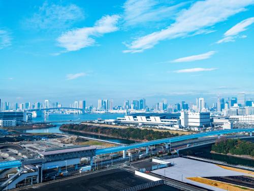 a view of a city with a bridge and buildings at Far East Village Hotel Tokyo Ariake in Tokyo