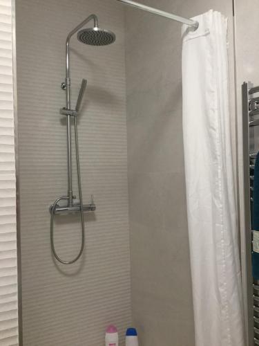 a shower in a bathroom with a shower curtain at Molino Ronda in Ronda