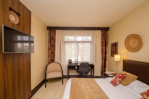 Postel nebo postele na pokoji v ubytování Muthu Silver Springs Hotel