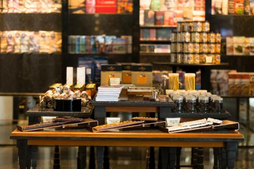 a table with books and other items on it in a store at The Sukhothai Bangkok in Bangkok
