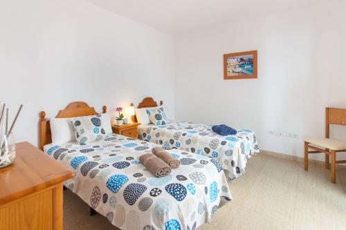 Postel nebo postele na pokoji v ubytování Casa Ancla