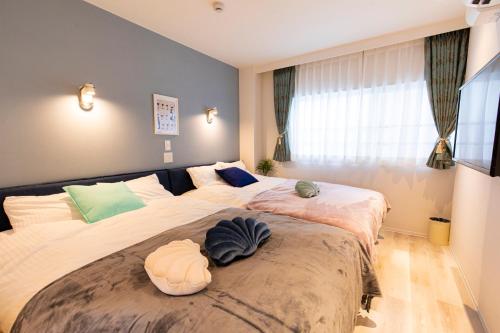 En eller flere senger på et rom på belle lune hotel hakata Suite Room 3