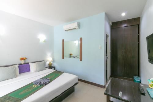Tempat tidur dalam kamar di Chaiyo Resort