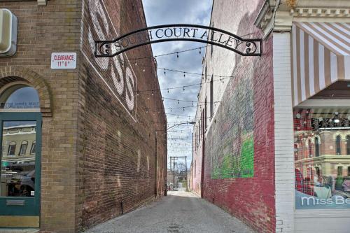 a street sign on the side of a brick building at Chic Main Street Retreat Less Than 7 Mi to KY Horse Park! in Georgetown