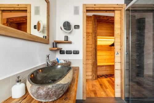 a bathroom with a sink and a shower at B&B Sot l'Agner - Ospitalità Diffusa Conca Agordina in Taibon