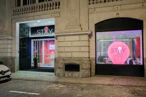 a store front with a pink heart in the window at Stay Hotel Lisboa Centro Chiado in Lisbon