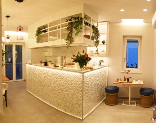 a kitchen with a counter with plants on it at B&B Dimora Vistamare in Barletta