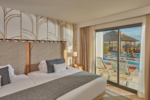 
a hotel room with a view of the ocean at Secrets Lanzarote Resort & Spa - Adults Only (+18) in Puerto Calero
