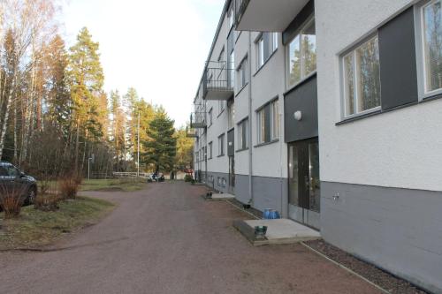 an empty street in front of a building at Comfortable Apartment MILA at a good location in Kotka