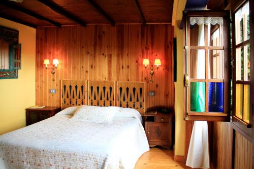 Postel nebo postele na pokoji v ubytování Casas Rurales Pradina I y II
